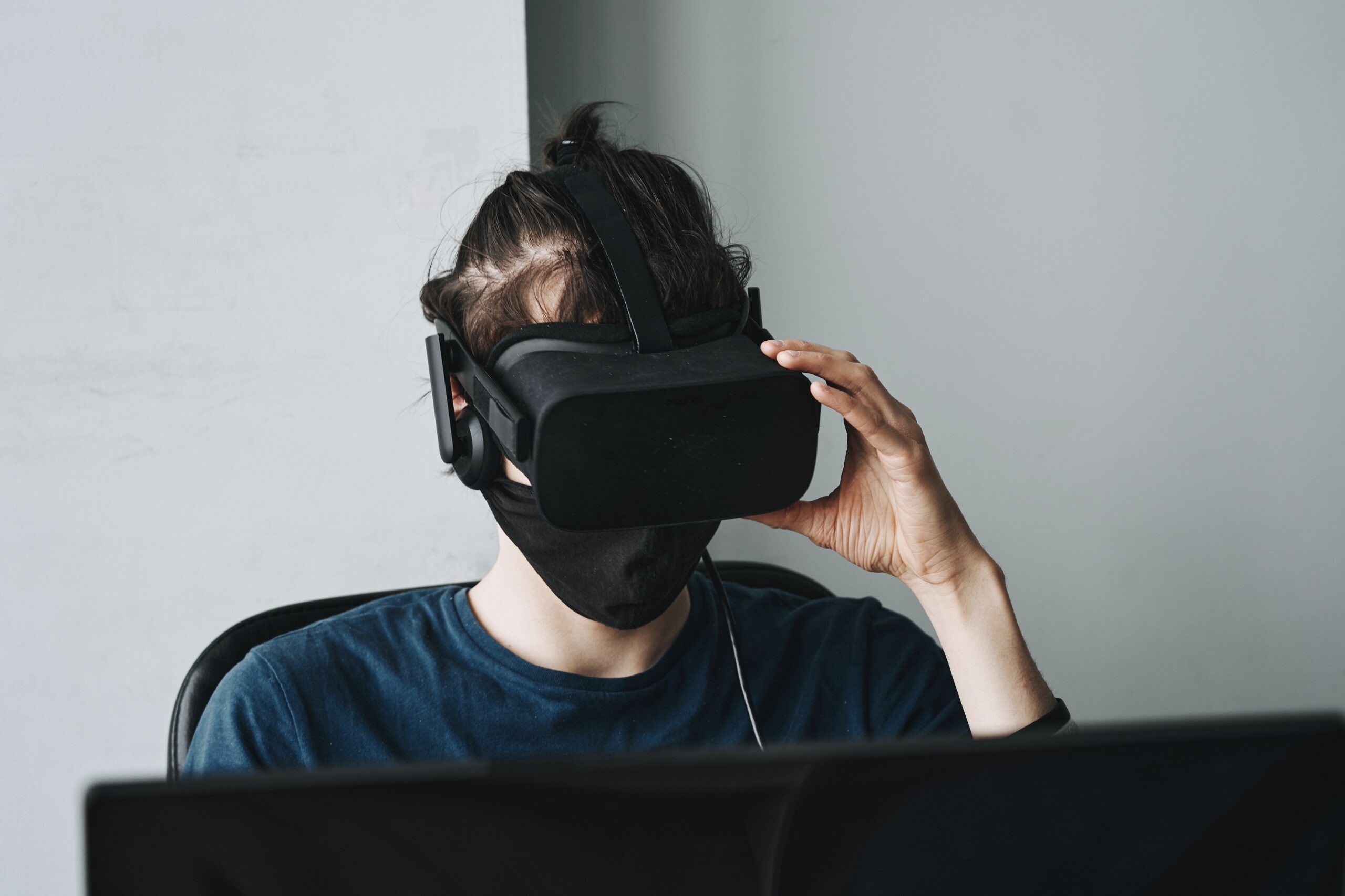 Crew neck shirt person wearing black VR Googles