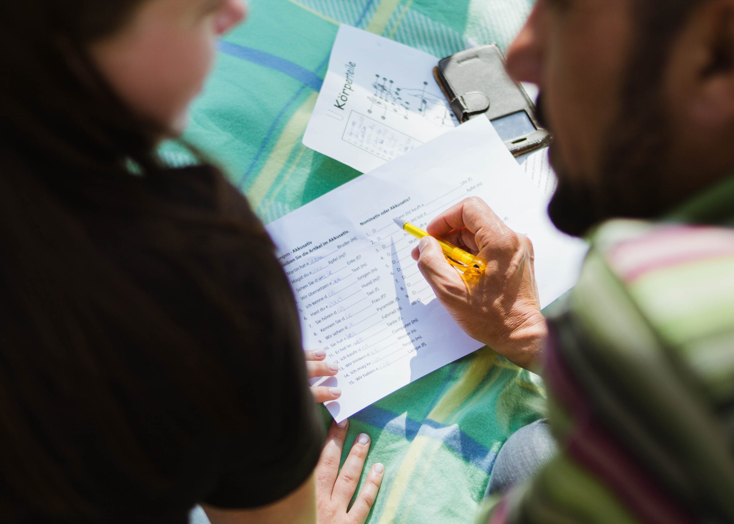 Man teaching a language to a woman