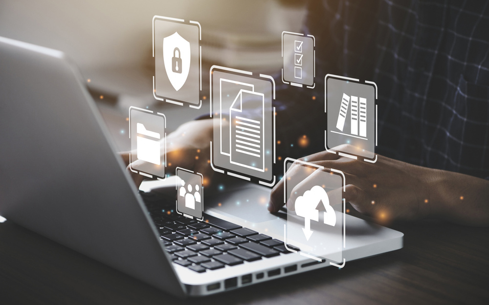 Businessman using a computer to document management concept, online documentation database and digital file storage system/software, records keeping, database technology, file access, doc sharing