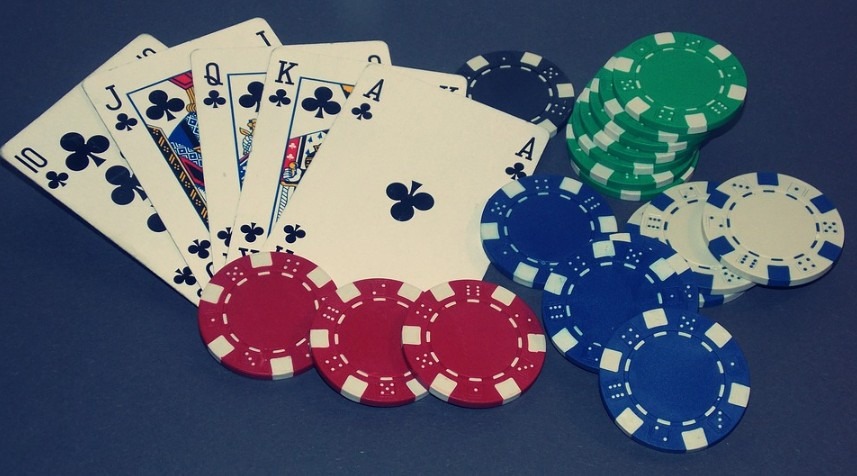 poker cards and chips on a table