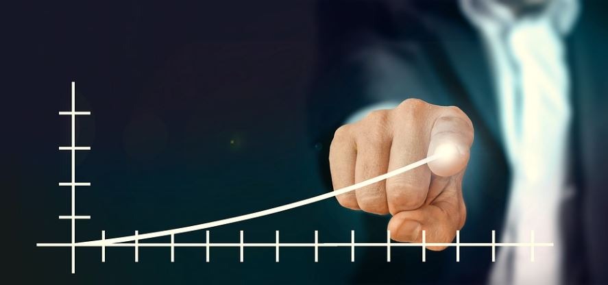 a person pointing his finger on the graph