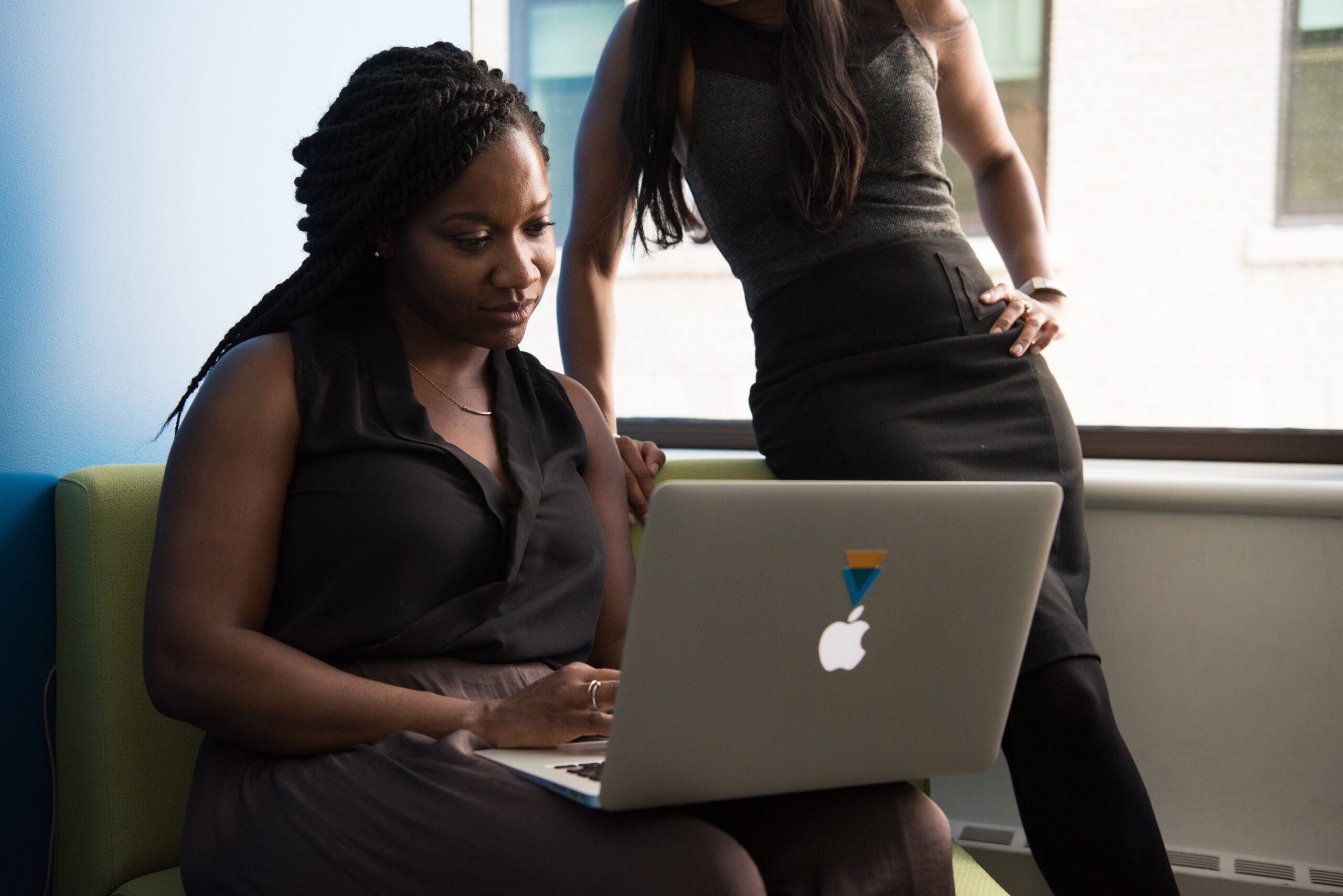 Two-black-women-looking-at-computer-screen